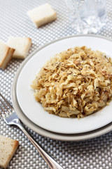 Fried cabbage with caraway and garlic on a plate