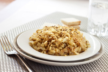 Fried cabbage with caraway and garlic on a plate