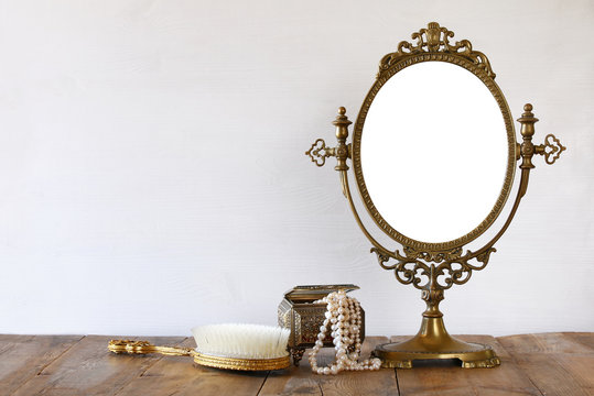 Old vintage oval mirror and woman toilet fashion objects