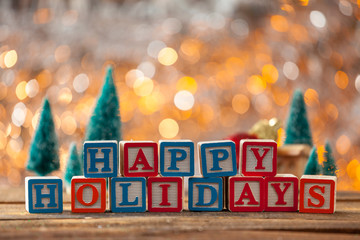 Happy Holidays Written With Toy Blocks On Christmas Card Backgro
