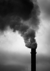 Environmental Damage: Air Pollution. The black smoke of the pipe.