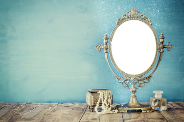 Old vintage oval mirror and woman toilet fashion objects