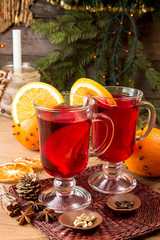 Two glasses of mulled wine over on wooden table.