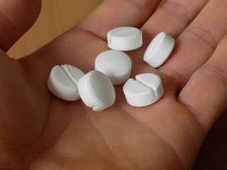 Pills on men hand in psychiatry in hospital