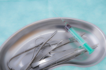 surgical instruments on green background