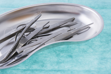 surgical instruments on green background