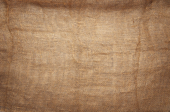 Linen fabric background with visible texture. Horizontal photo taken from above, top view with copy space for packaging, text and other web or print design elements.
