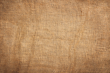 Linen or jute fabric background with visible texture. Horizontal photo taken from above, top view with copy space for packaging, text and other web or print design elements.