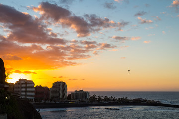 Naklejka premium Magnificent sunset aerial view of beach and buildings of Tenerife, Spain.