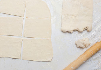 rolling the dough in the kitchen