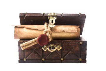 The ancient chest and a scroll with a seal isolated on white
