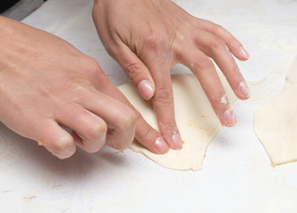 rolling the dough in the kitchen