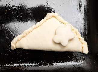 pastry pies on a baking sheet