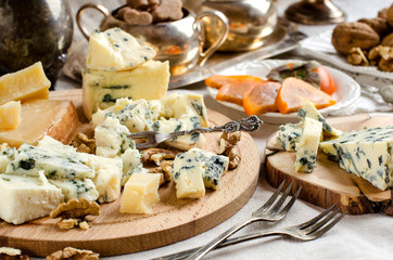Parmesan and other cheeses on the table