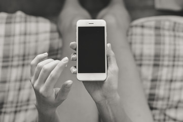 Closeup picture on hand using mobile smart phone, copy space background