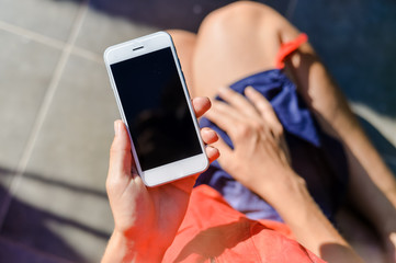 Beautiful young lady using smartphone