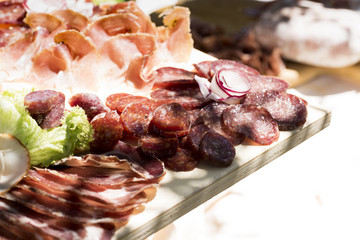 reach of the kitchen of typical Italian cold cuts, pork: salciccia , prosciutto , salami