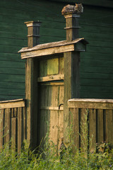 Wooden gate and fence to the front yard.