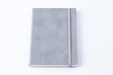 Grey leather notebook isolated on white background