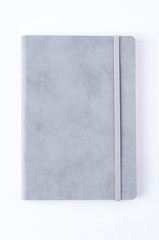 Grey leather notebook isolated on white background