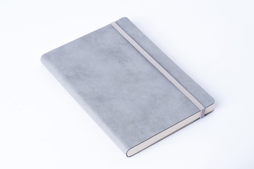 Grey leather notebook isolated on white background