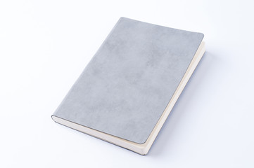 Grey leather notebook isolated on white background