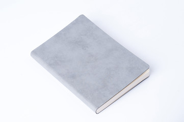 Grey leather notebook isolated on white background.