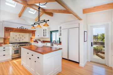 Kitchen interior in new luxury home with kitchen island.