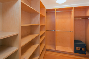 Wide wooden dressing room, interior of a modern house