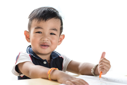 asian baby boy feel happy drawing and use crayon