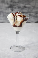 ice cream with chocolate syrup in an ice-cream bowl, selective focus