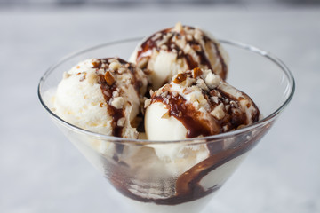 ice cream with chocolate syrup in an ice-cream bowl, selective focus