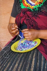  African woman making souvenirs for sell at Lesedi Cultural Villa © pulpitis17