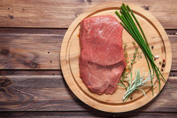 piece of beef and vegetables on a table, selective focus