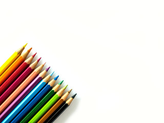 Colorful pencils on white background