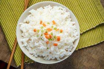 Jasmine rice with chopsticks on a fabric mat