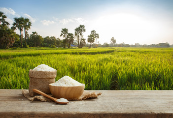 Asian white rice or uncooked white rice with the rice field back