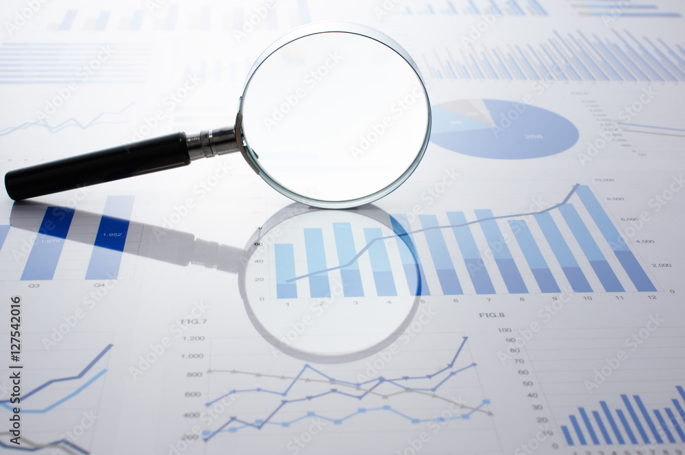 Poster Accounting data, charts and magnifying glass. Many charts and graphs. Reflection light and flare.
