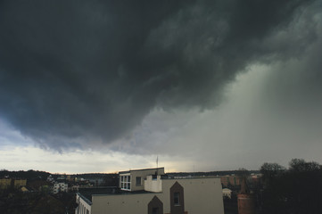 Fototapeta na wymiar Storm dark clouds over city
