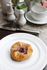 dessert baked or fruit bread on white dish.