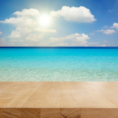 Empty wooden table on the beach. Can put your products for display.