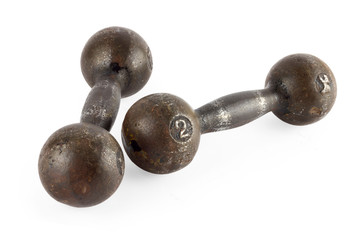 Two old iron dumbbells, isolated on a white background