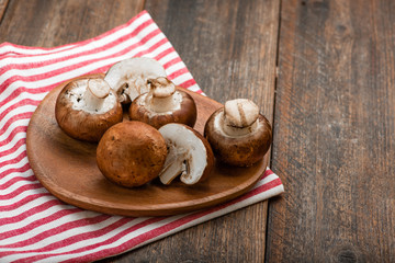 Fototapeta na wymiar Mushrooms on a rustic wooden table. Copyspace.