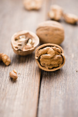 Walnuts on wooden table. Macro. Front view