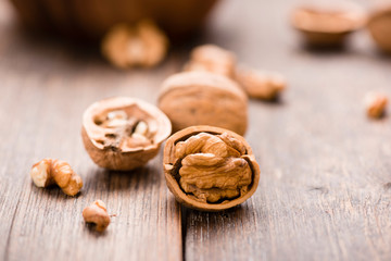 Walnuts on wooden table. Macro. Front view
