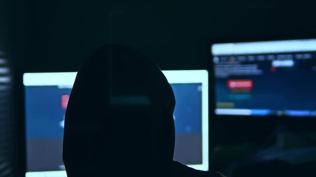 hacker man, trying to breach security of a computer system search internet