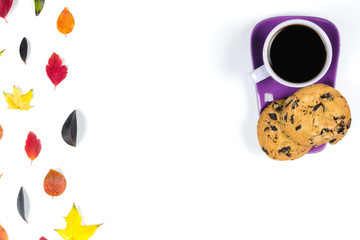 Colourful fall leaves and Purple coffee cup with saucer, spoon isolated on white background