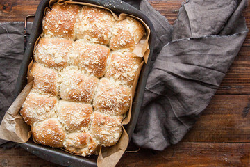 fresh homemade muffins in a baking dish. View from above. wooden background.