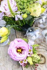 Wedding boutonniere with pink eustoma and chamelaucium flowers.