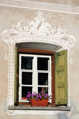 Fototapeta na wymiar Typical window with decorations. Guarda Village, Scuol, Engadine, Switzerland 